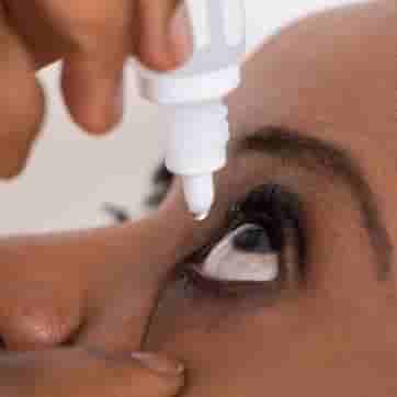 Woman applying glaucoma eye drops as part of treatment to help manage eye pressure and protect vision