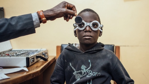 Eye specialist checking refraction error
